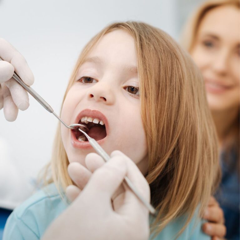 an image of a small child at the pediatric dentist.