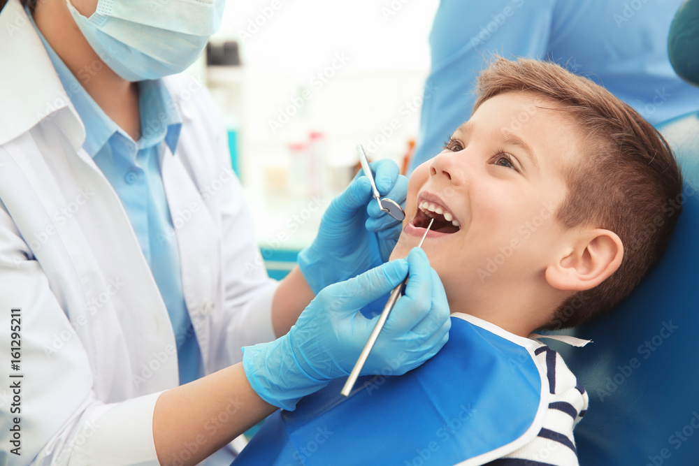 an image of a child during a dental procedure.